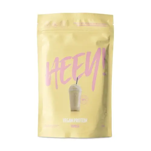 En beige påse med veganskt, ekologiskt proteinpulver med vaniljsmak tillverkat av märket "Heey"